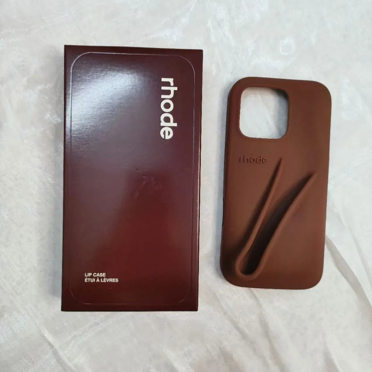 Custodia per telefono in silicone Rhode con scatola per iPhone 16, 15, 14, 13, 12 Pro Max Plus, custodia portatile per lucidalabbra e rossetto.